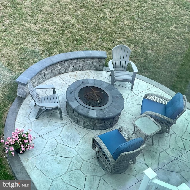 view of patio / terrace featuring an outdoor fire pit