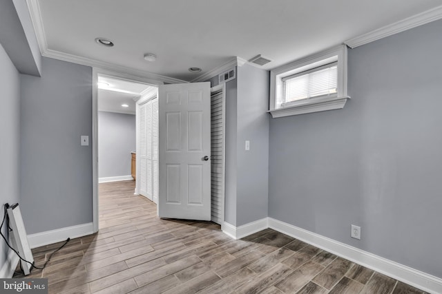 interior space featuring light hardwood / wood-style floors and ornamental molding