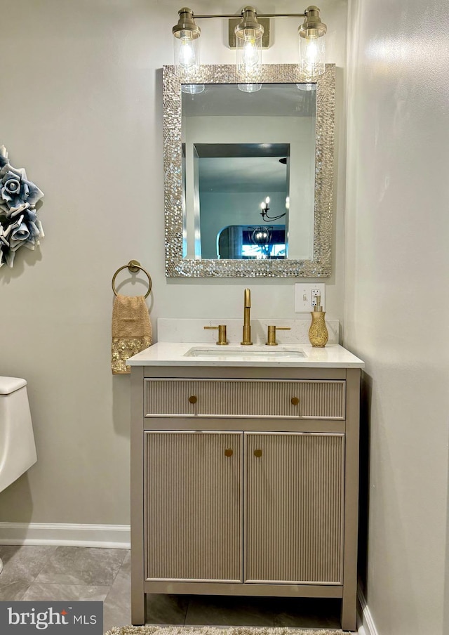 bathroom with tile patterned flooring and vanity