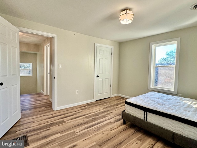 bedroom featuring light wood-type flooring