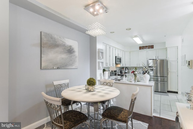 dining space with dark hardwood / wood-style flooring