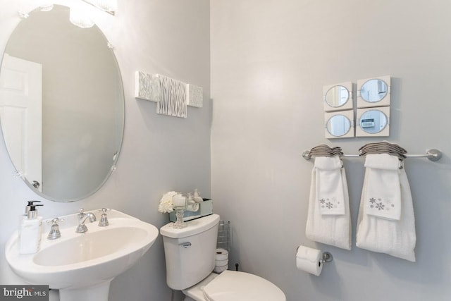 bathroom with toilet and sink