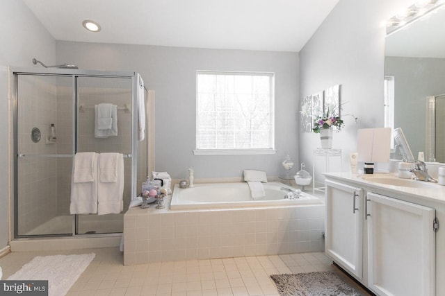 bathroom featuring tile patterned floors, vanity, and plus walk in shower