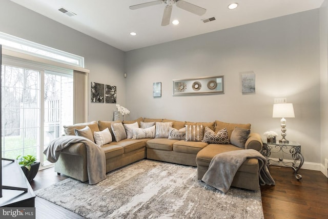 living room with hardwood / wood-style flooring and ceiling fan