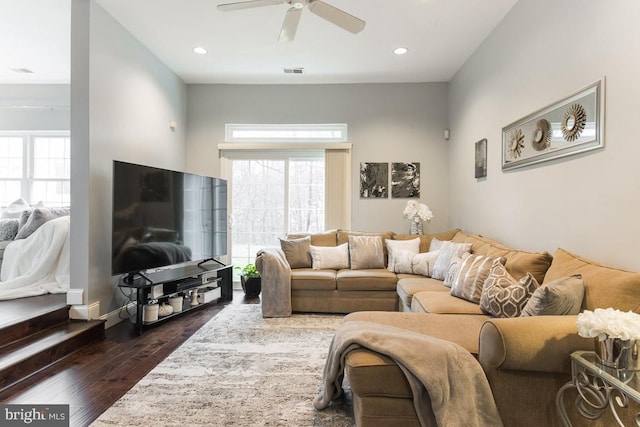 living room featuring dark hardwood / wood-style floors and ceiling fan