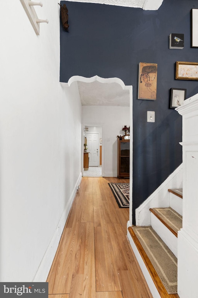 hall with light wood-type flooring