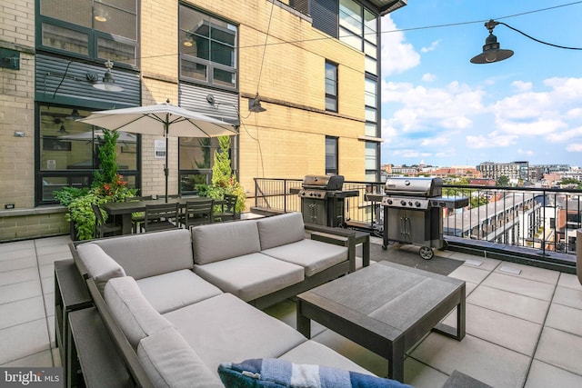 view of patio featuring outdoor dining area, outdoor lounge area, a city view, and area for grilling