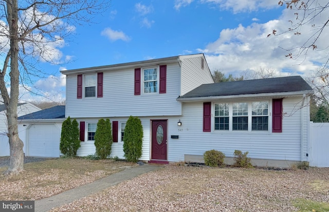 view of front of property with a garage