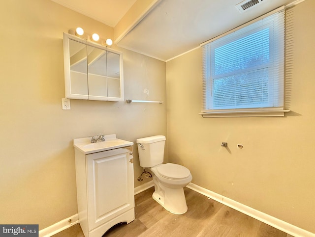 bathroom featuring hardwood / wood-style floors, vanity, and toilet