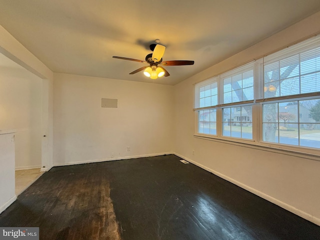 spare room featuring ceiling fan and wood-type flooring