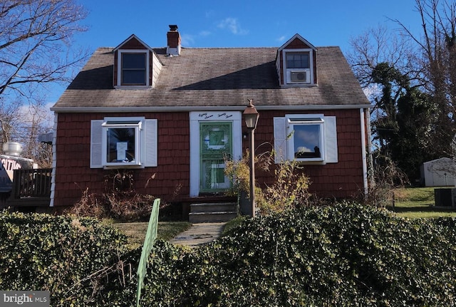 cape cod home with central AC unit