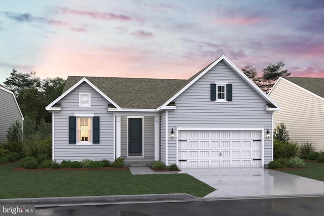 view of front of house with a garage and a yard