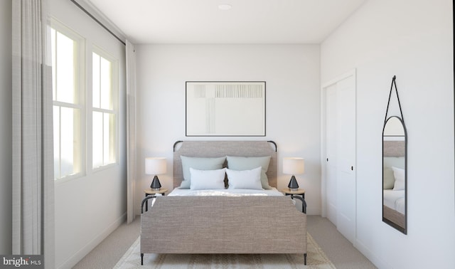 bedroom with light colored carpet and multiple windows