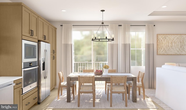 kitchen featuring a chandelier, decorative light fixtures, light brown cabinets, and stainless steel appliances