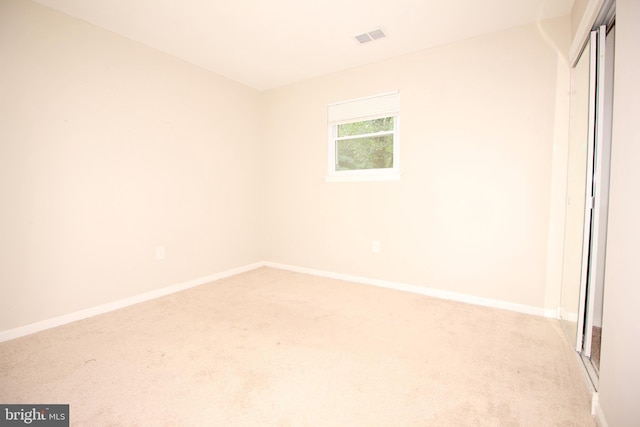 unfurnished bedroom featuring light colored carpet