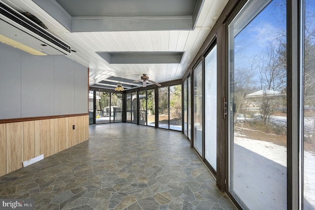 corridor with wooden walls and expansive windows