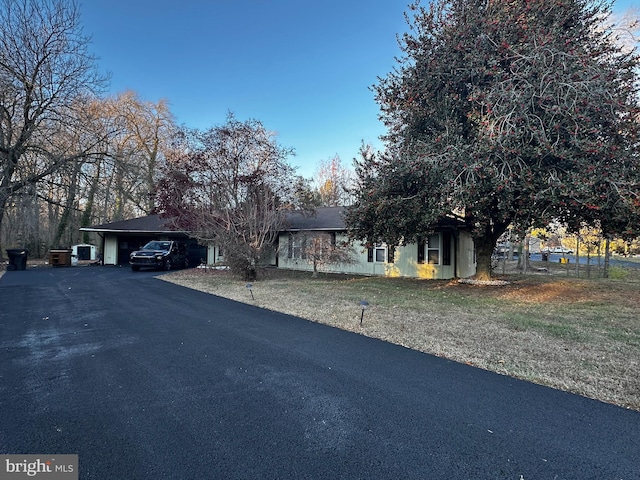 view of front of home featuring a carport