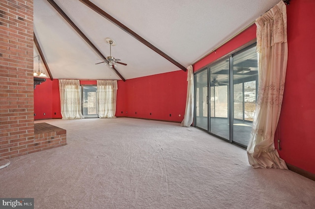 unfurnished living room with ceiling fan, vaulted ceiling with beams, and light colored carpet