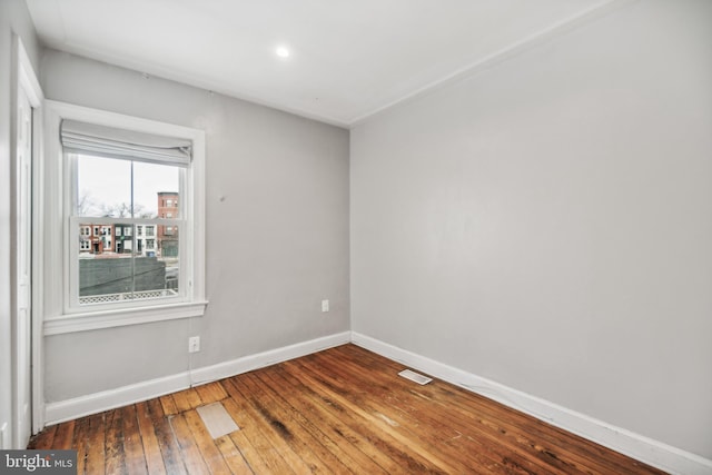 unfurnished room with dark hardwood / wood-style floors