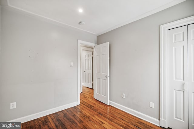 unfurnished bedroom with wood-type flooring