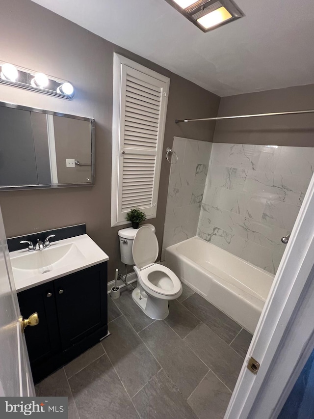 full bathroom with tile patterned flooring, vanity, toilet, and tiled shower / bath