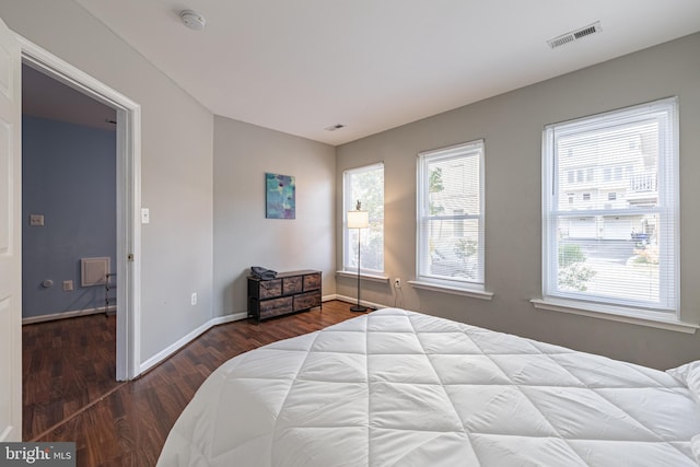 bedroom with hardwood / wood-style floors