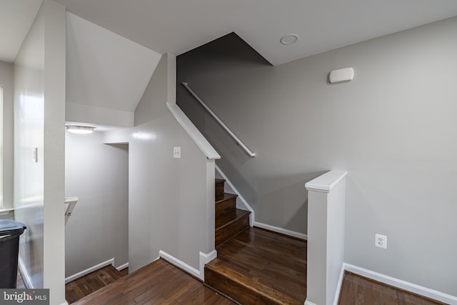 stairway with hardwood / wood-style flooring