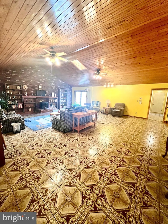 interior space with vaulted ceiling, ceiling fan, and wood ceiling