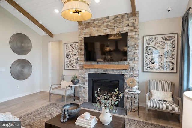 living room with wood ceiling, a fireplace, lofted ceiling with beams, and wood-type flooring