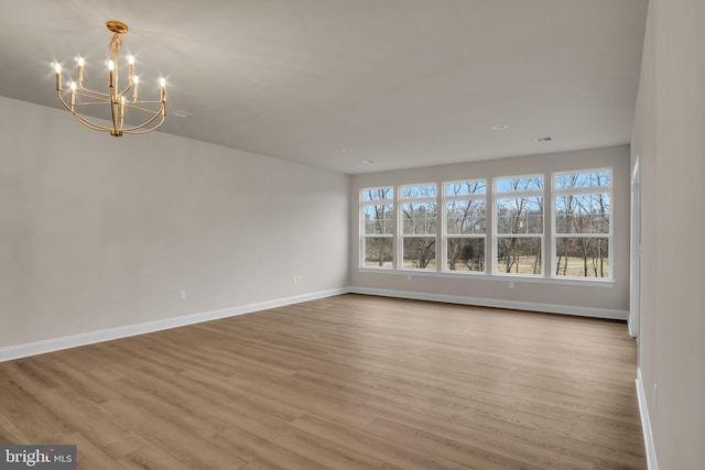 interior space featuring a chandelier and light hardwood / wood-style flooring