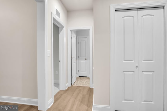 corridor featuring light hardwood / wood-style flooring