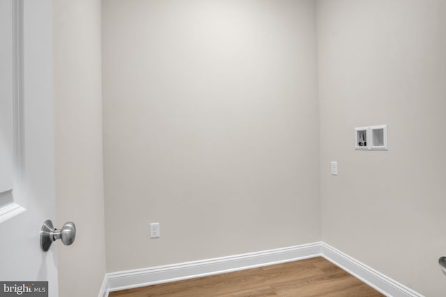 laundry area with hardwood / wood-style floors and hookup for a washing machine