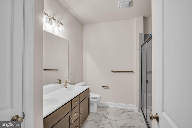 bathroom with vanity, toilet, and walk in shower