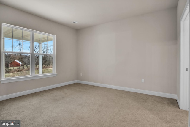 empty room with light colored carpet