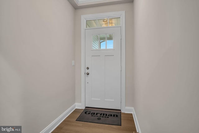 entryway with hardwood / wood-style floors