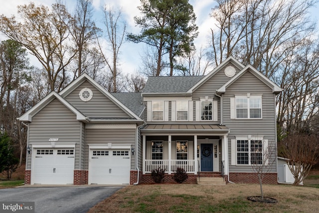 view of front facade with a front lawn and covered porch