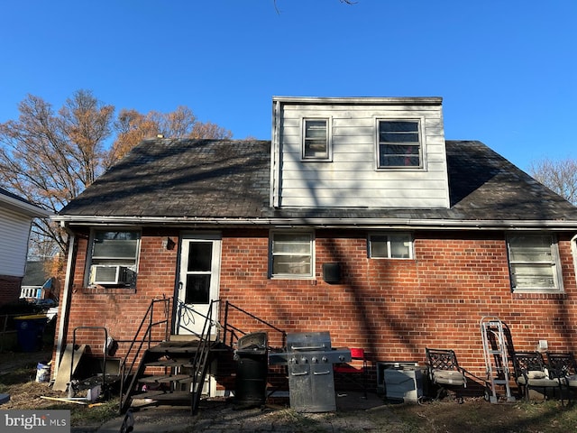 back of house featuring cooling unit