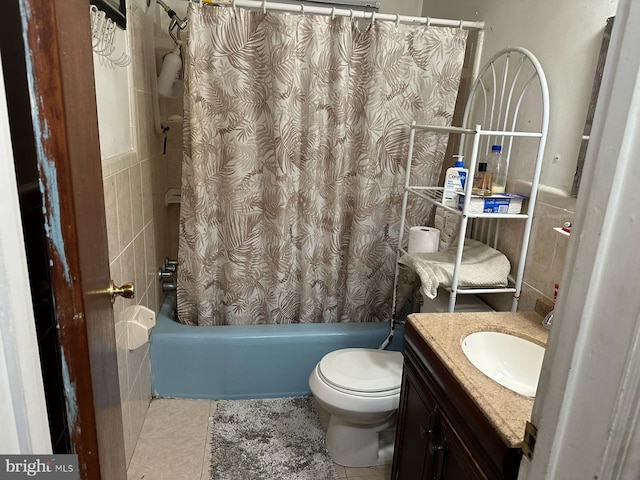 full bathroom featuring tile patterned floors, vanity, shower / bath combination with curtain, and toilet