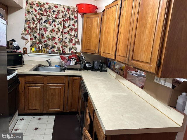 kitchen with black stove and sink