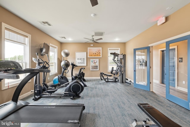 workout area with carpet, french doors, ceiling fan, and a healthy amount of sunlight