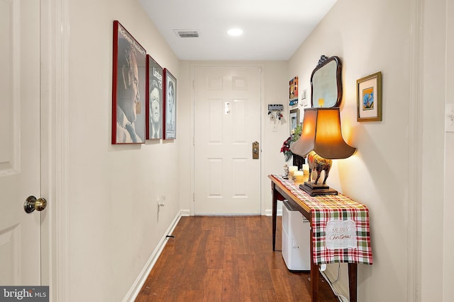 corridor featuring dark hardwood / wood-style flooring