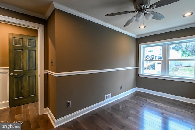 spare room with ceiling fan, dark hardwood / wood-style flooring, and crown molding