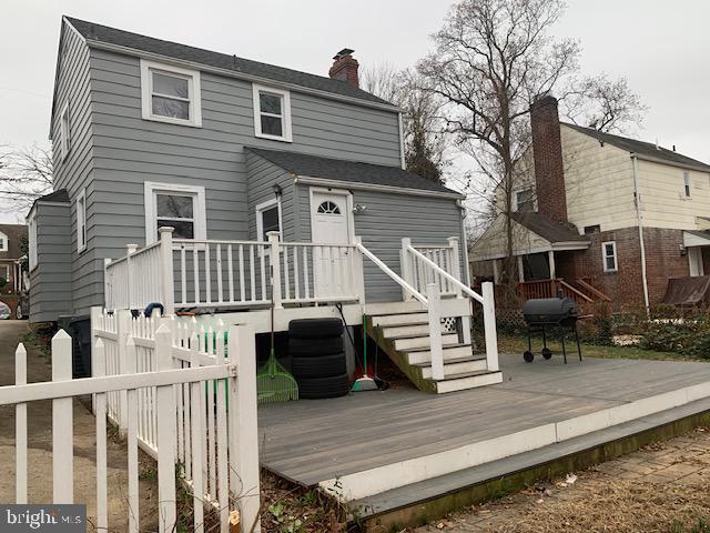 back of property featuring a wooden deck