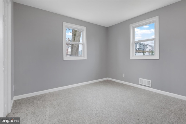 unfurnished room with carpet flooring