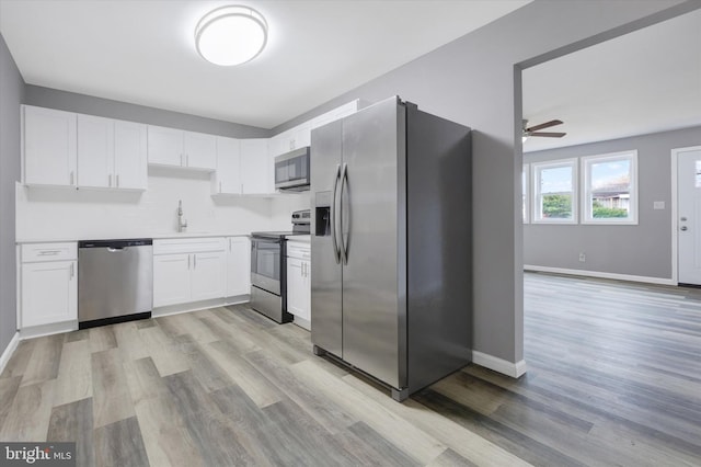 kitchen with white cabinetry, ceiling fan, sink, light hardwood / wood-style flooring, and appliances with stainless steel finishes