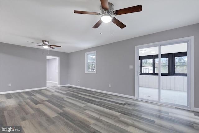 unfurnished room with hardwood / wood-style flooring and ceiling fan