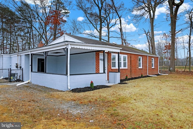 view of home's exterior with a yard