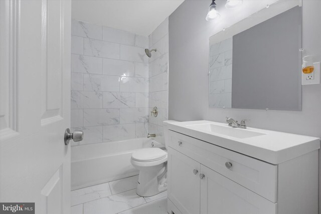 full bathroom with vanity, toilet, and tiled shower / bath combo