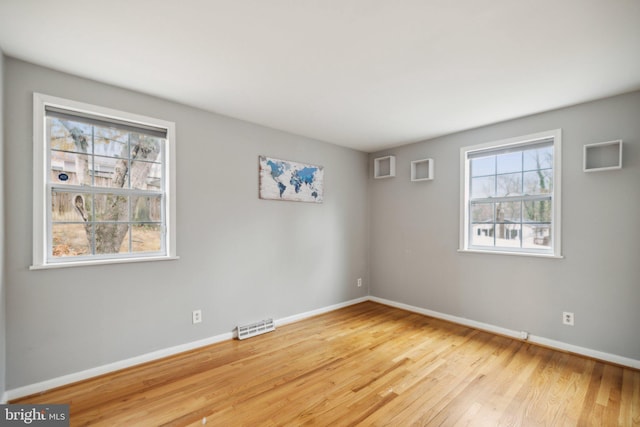 empty room with light wood-type flooring