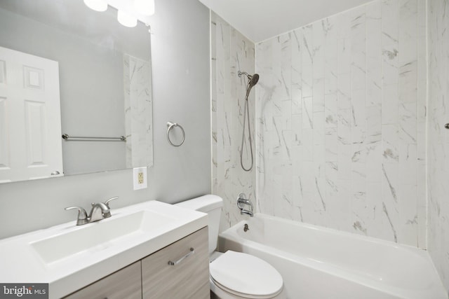 full bathroom with toilet, vanity, and tiled shower / bath